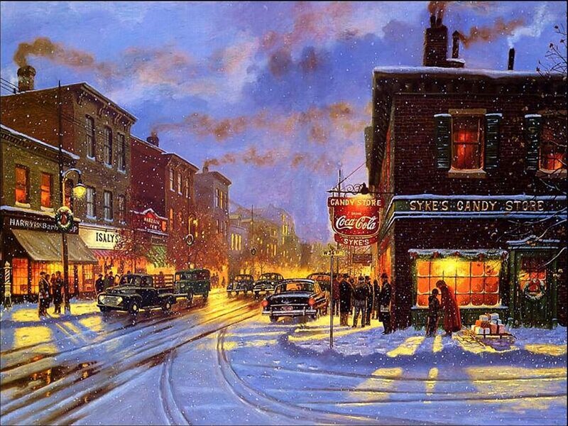 Snowy town street at night