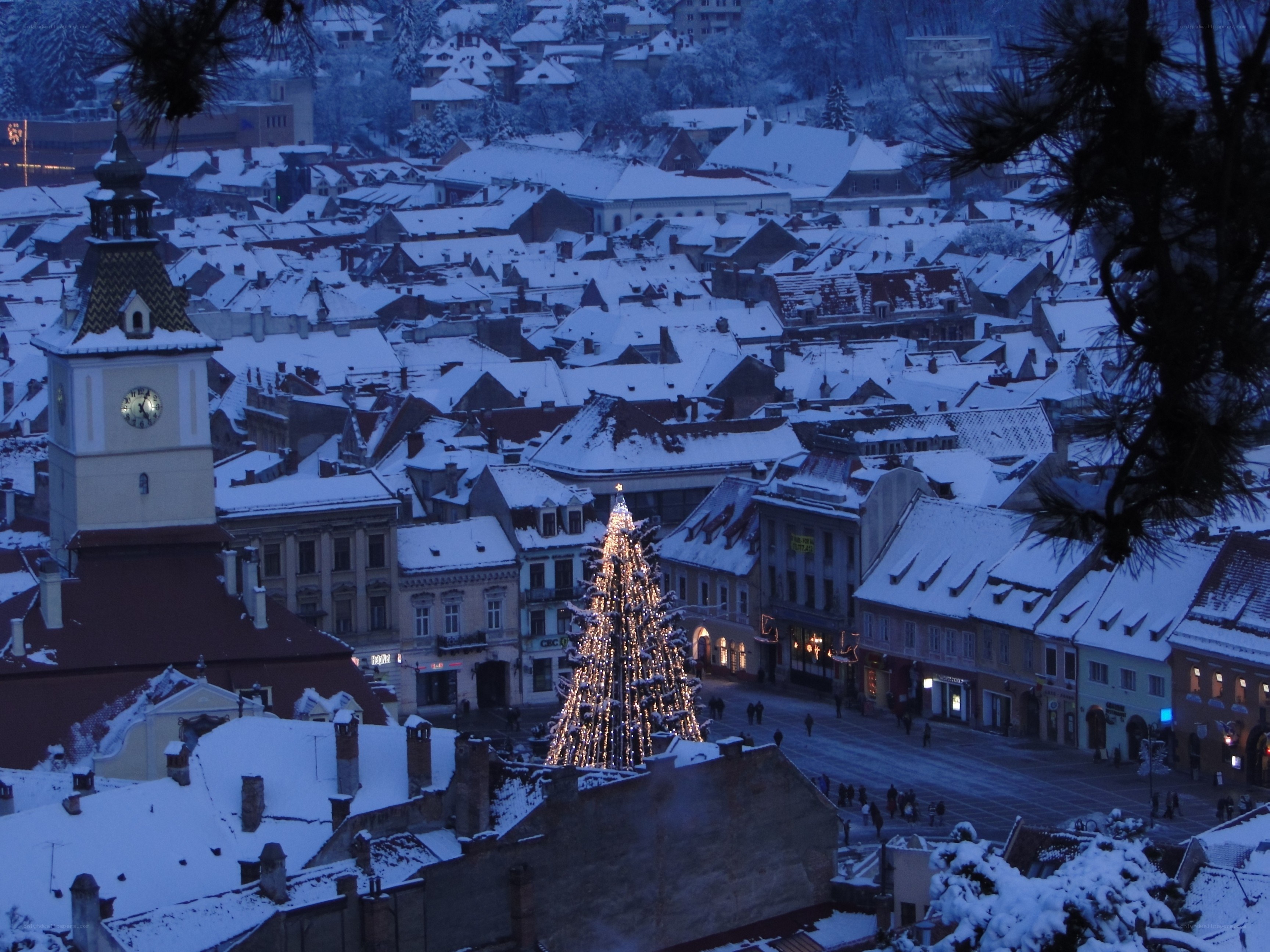 Snowy town with Christmas tree