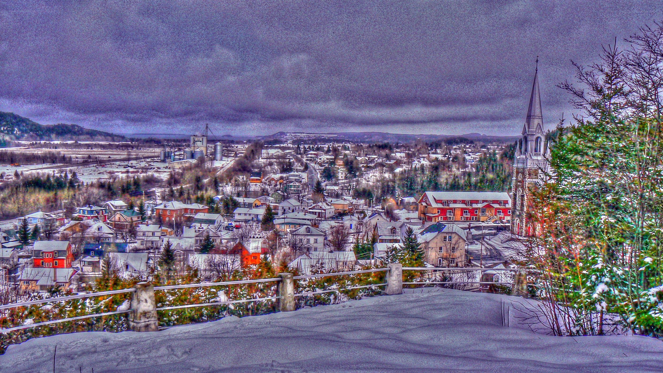 Snowy town with church steeple