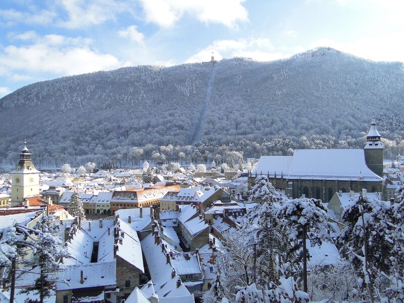 Snowy town with mountain view