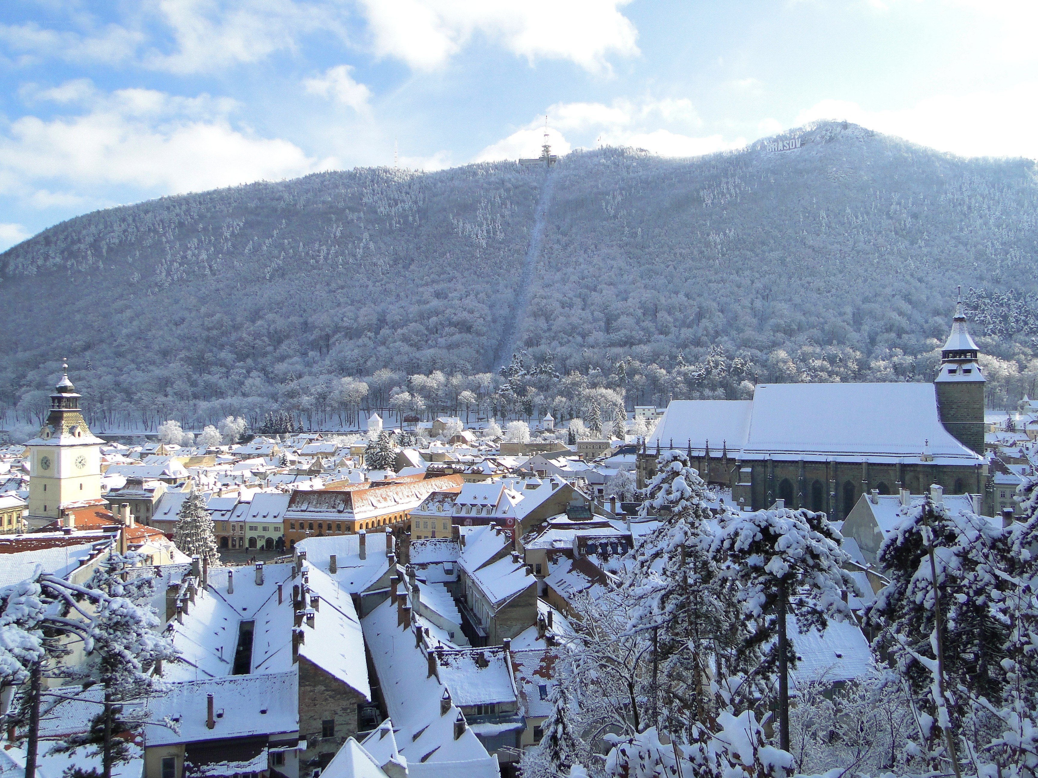 Snowy town with mountain view