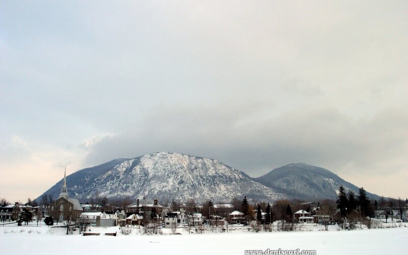 Snowy town with mountains
