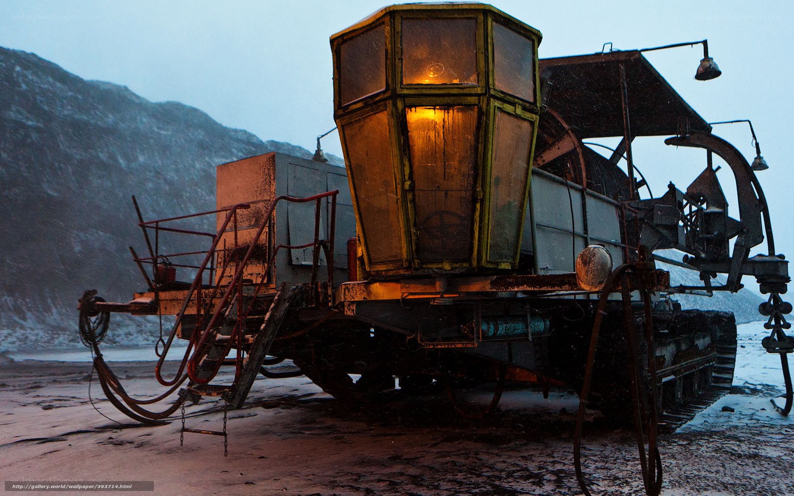 Snowy tractor at dusk