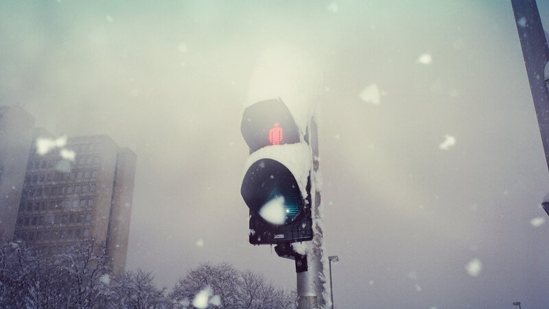 Snowy traffic light in winter