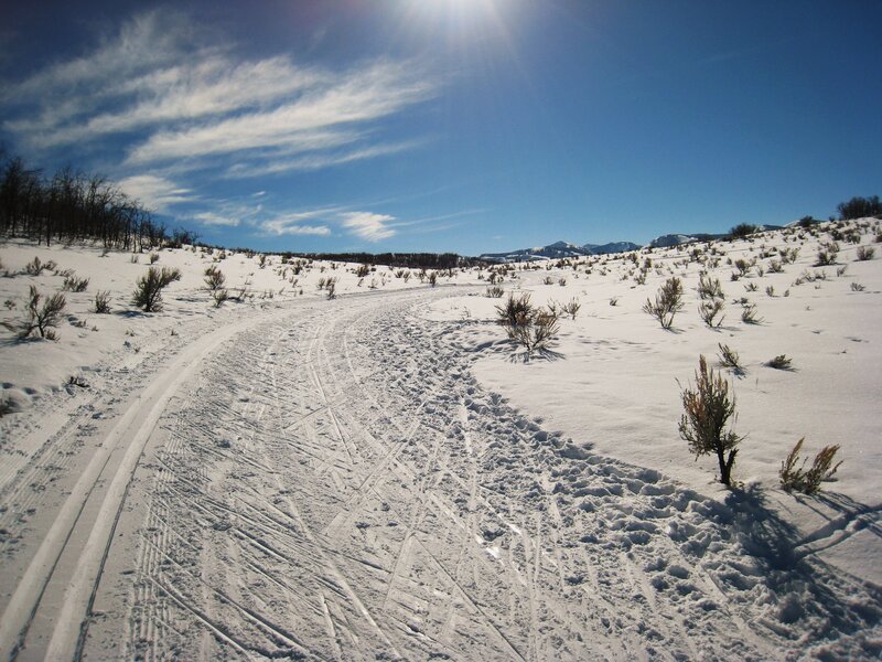 Snowy trail in mountain landscape