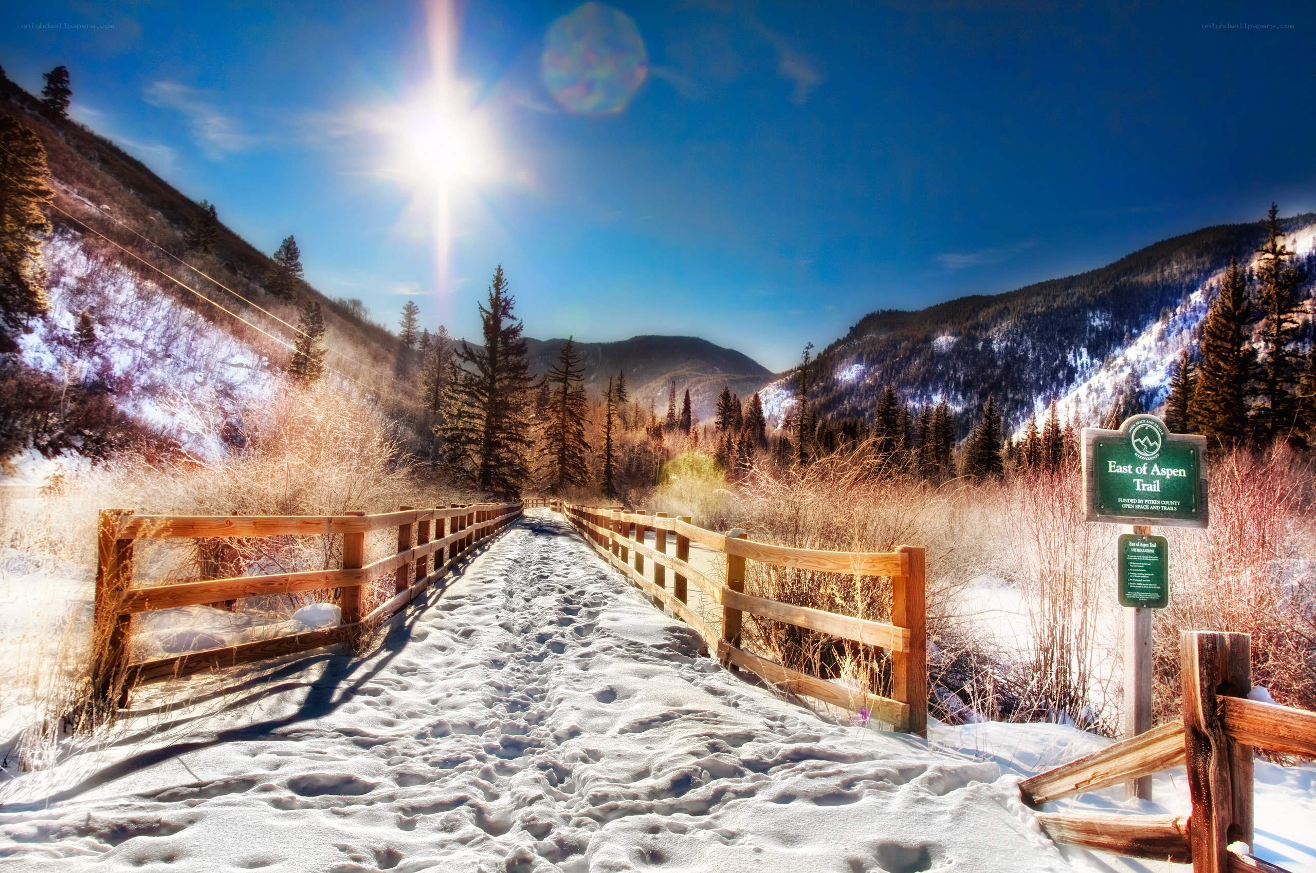Snowy trail in mountain valley