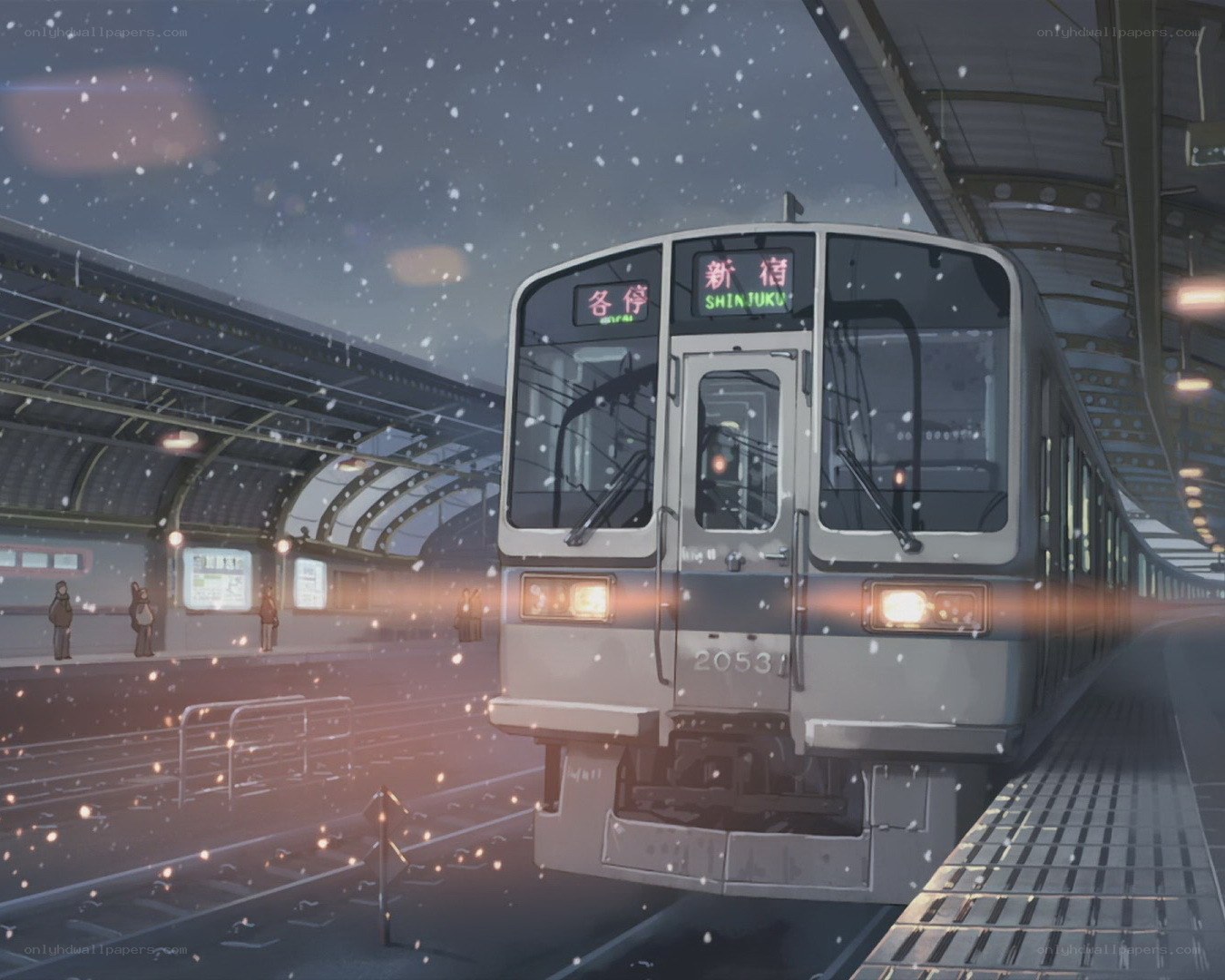 Snowy train at station