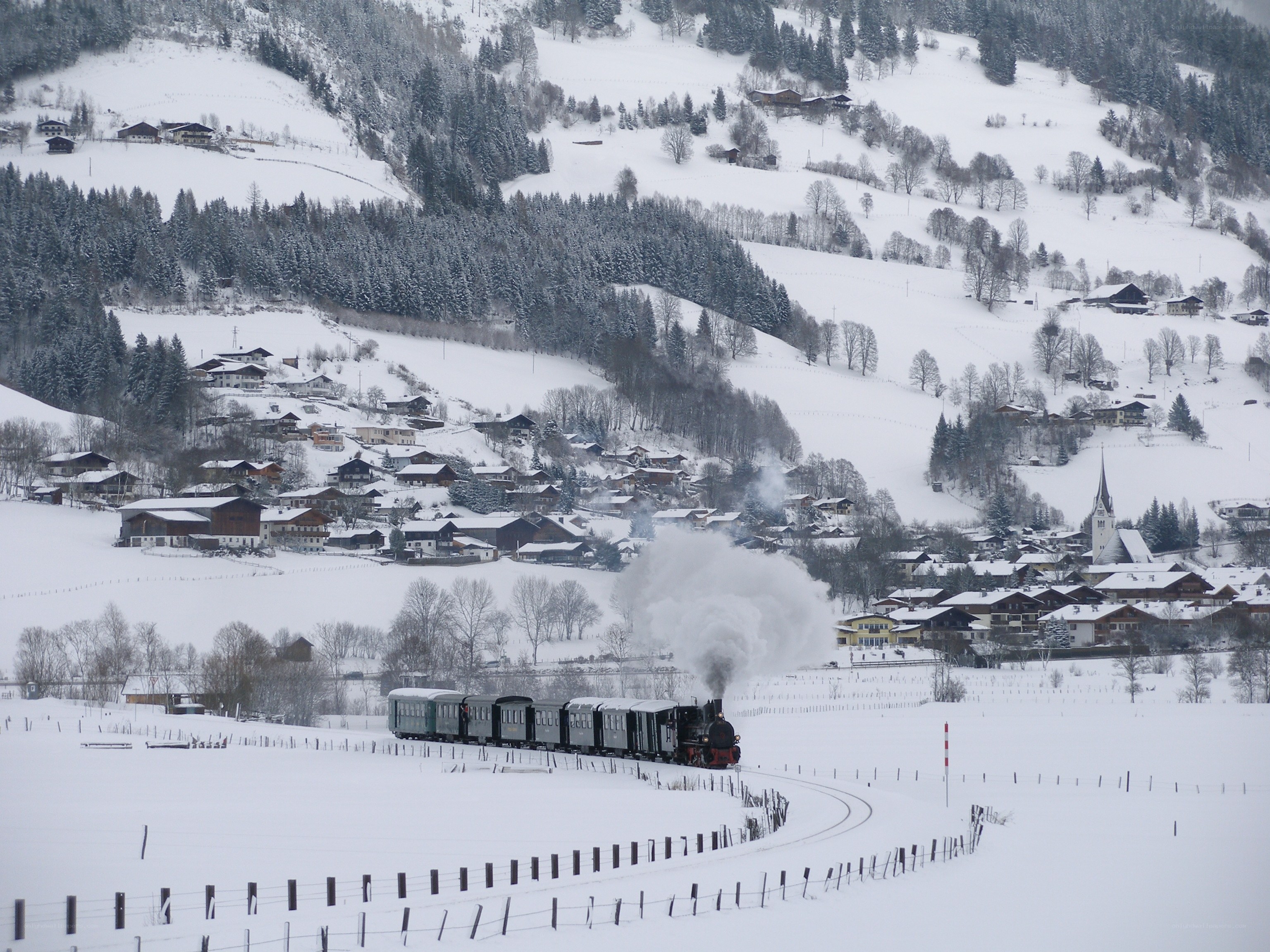 Snowy train in mountain village