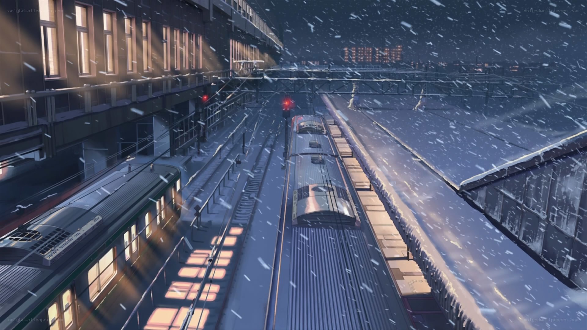 Snowy train station at night
