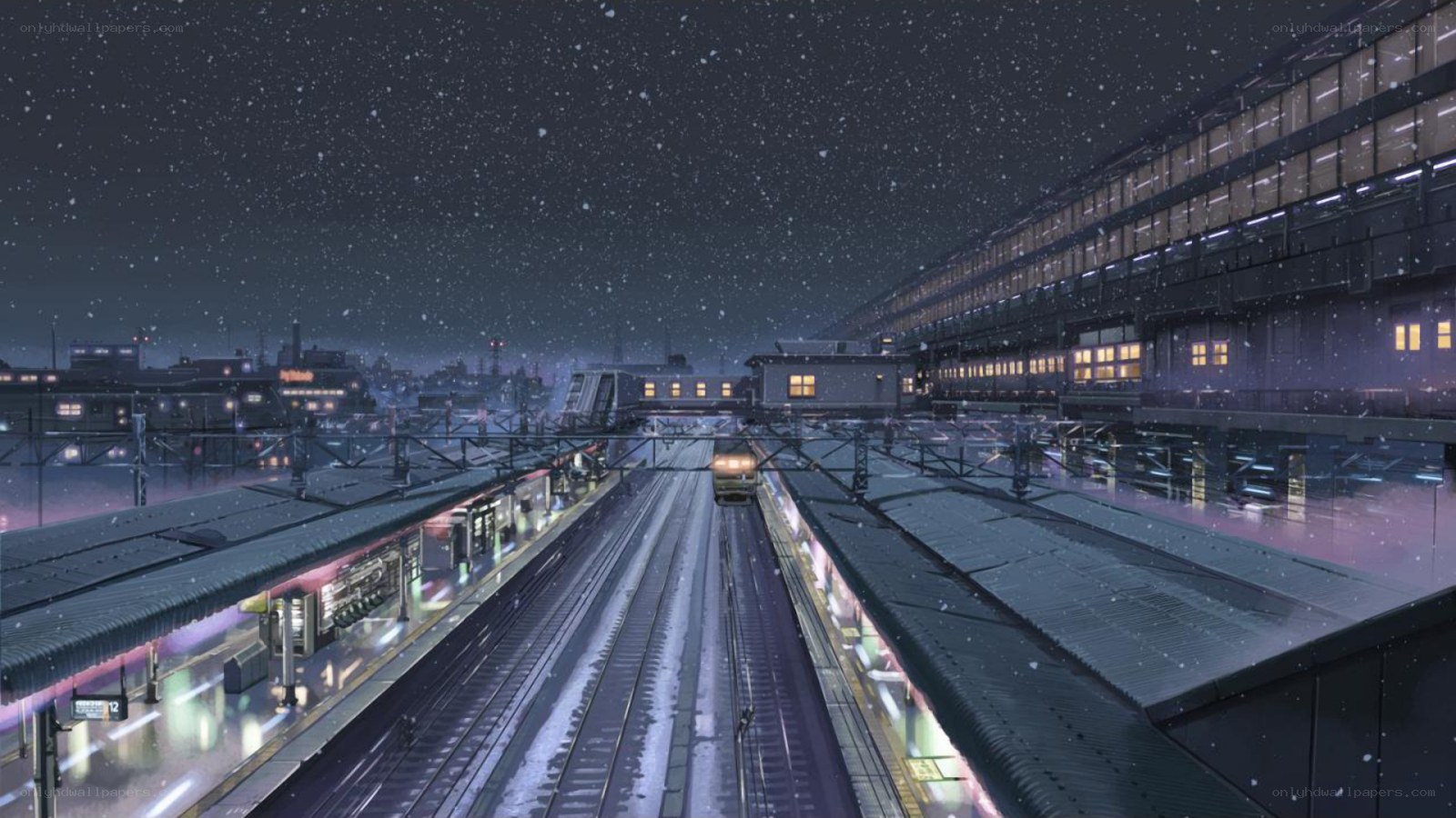 Snowy train station at night