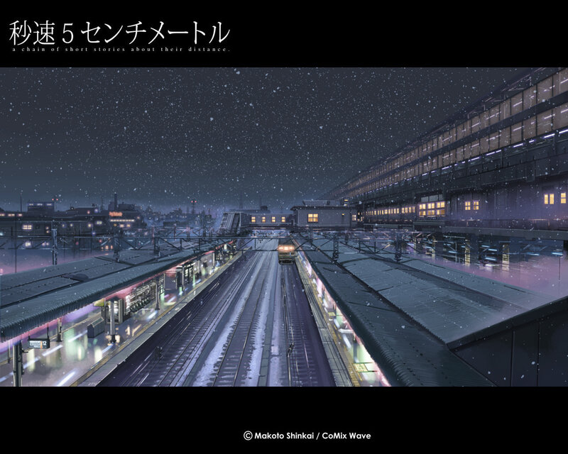 Snowy train station at night