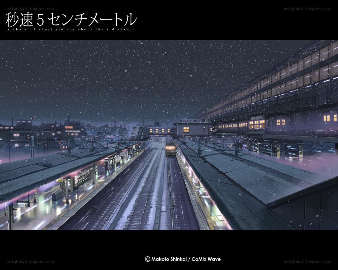 Snowy train station at night