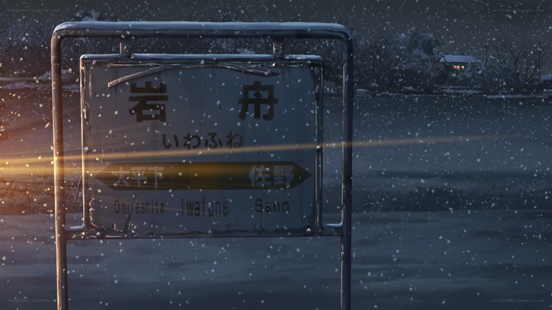 snowy train station sign