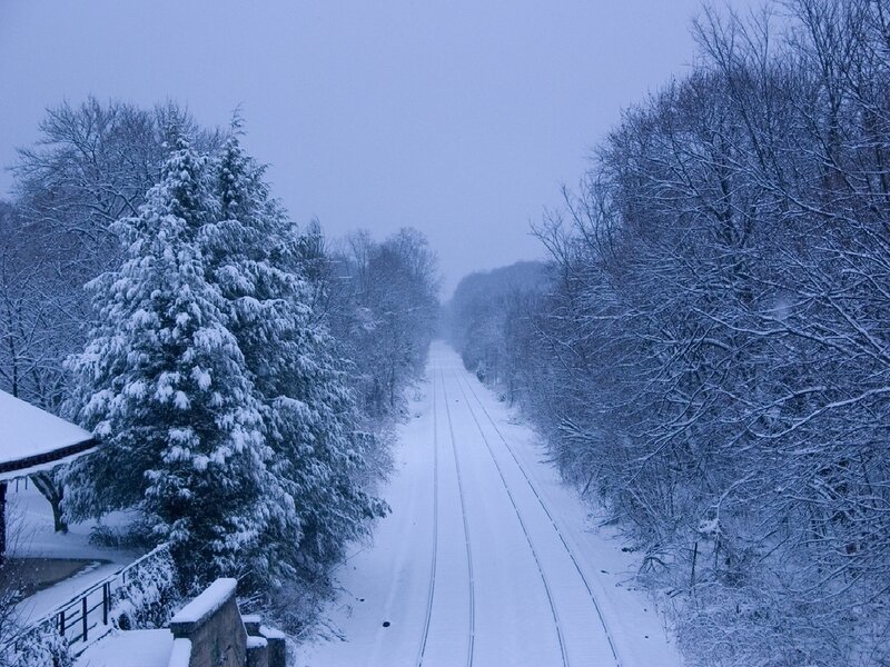 Snowy train tracks in winter