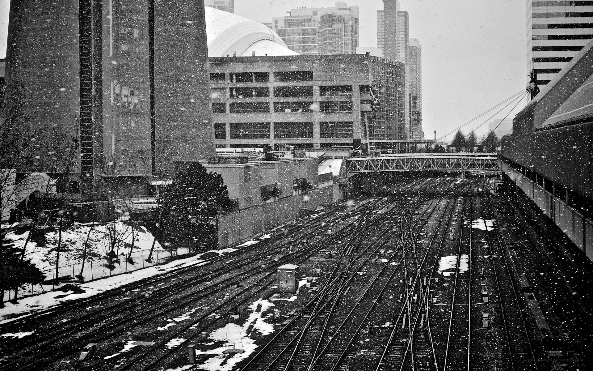 Snowy train yard in city