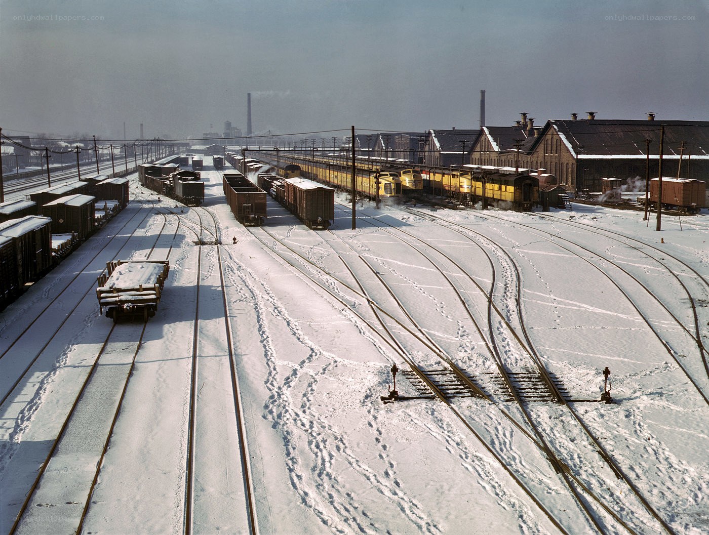 Snowy train yard with locomotives