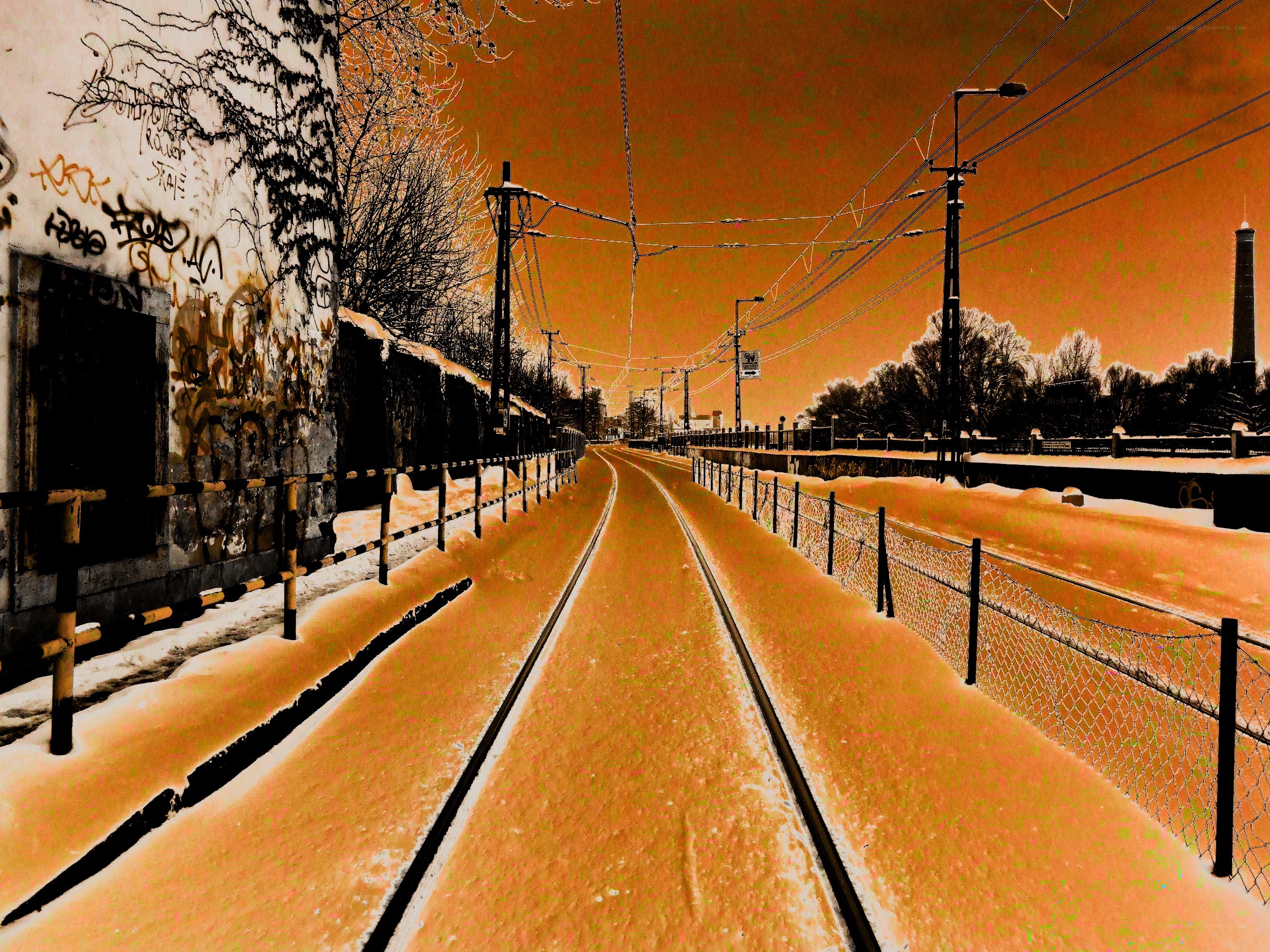 snowy tram tracks in urban setting