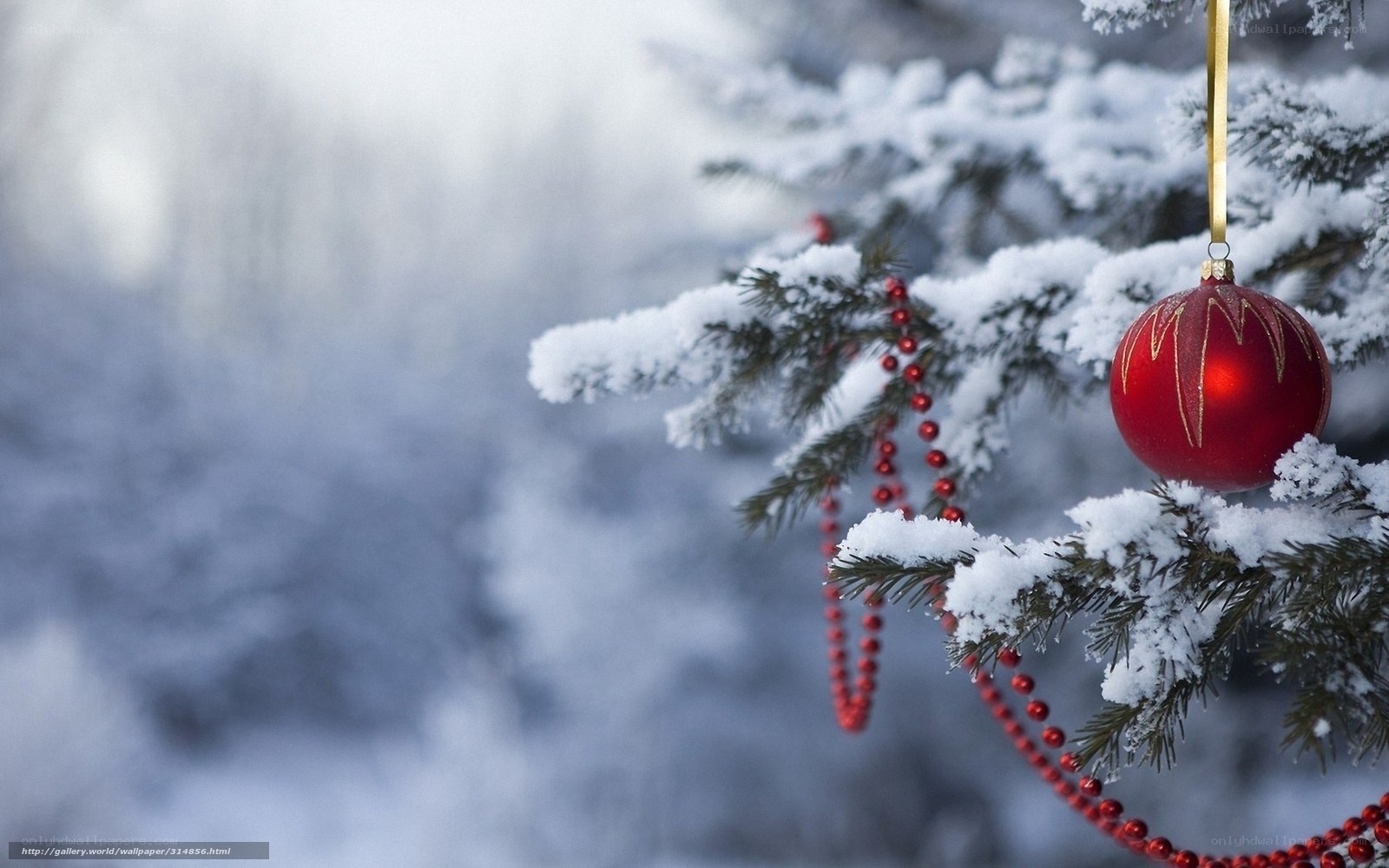 snowy tree with red ornament