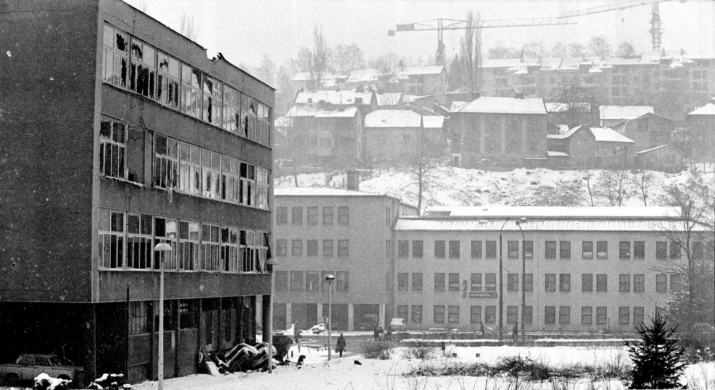 Snowy urban scene with damaged building