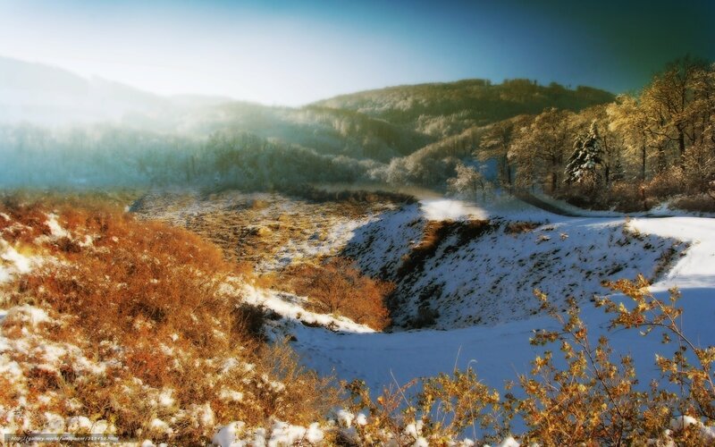Snowy valley at sunrise