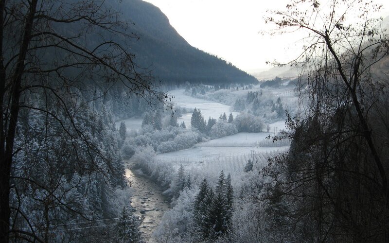 Snowy valley river landscape