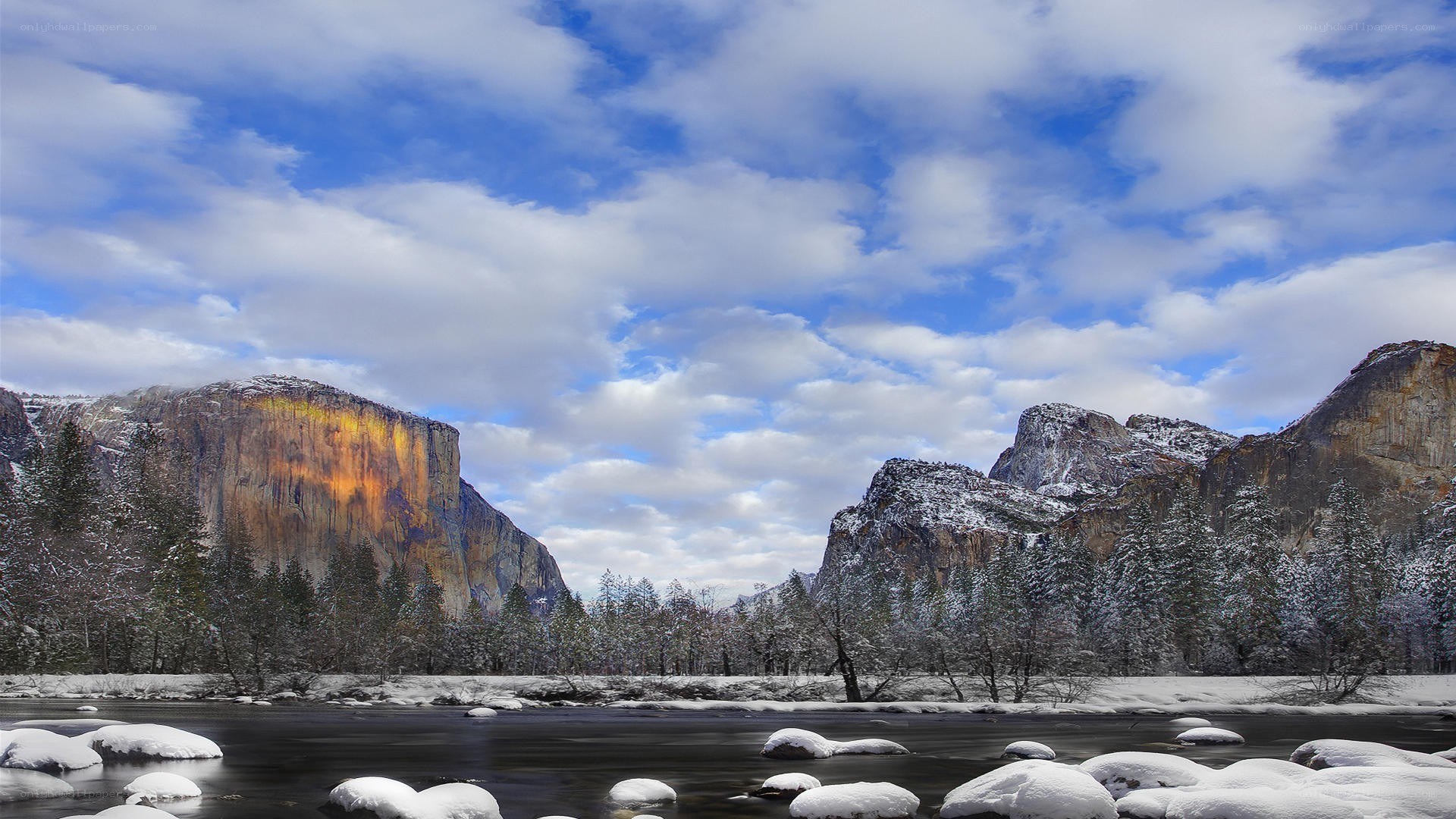 Snowy valley with river and mountains