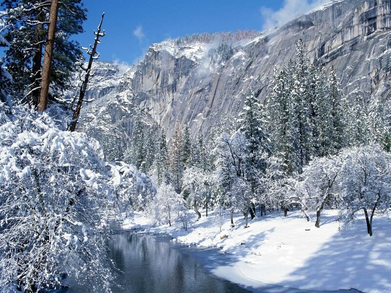 Snowy valley with river and mountains