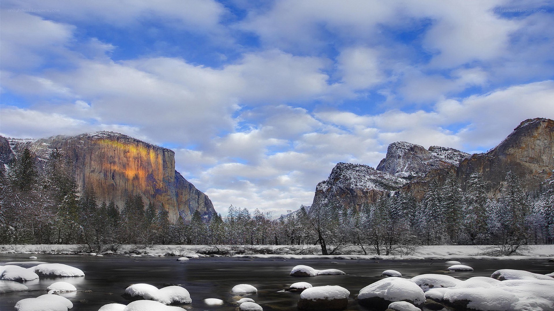 Snowy valley with river and mountains