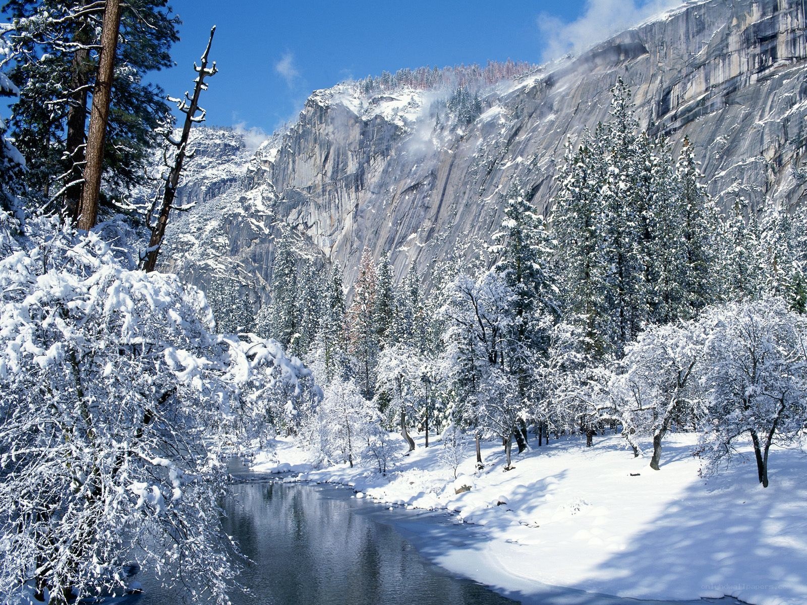 Snowy valley with river