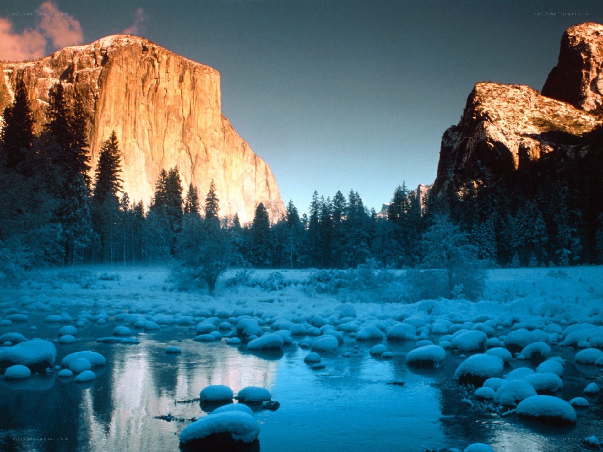 Snowy valley with rock formations