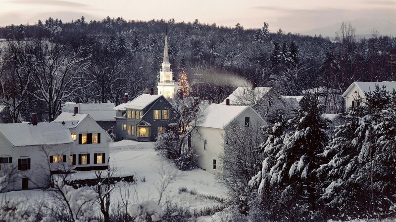 Snowy village at dusk