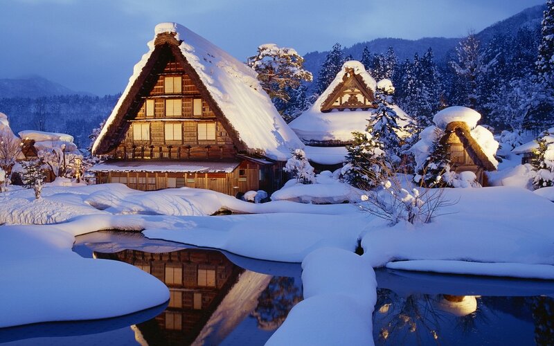 Snowy village at dusk