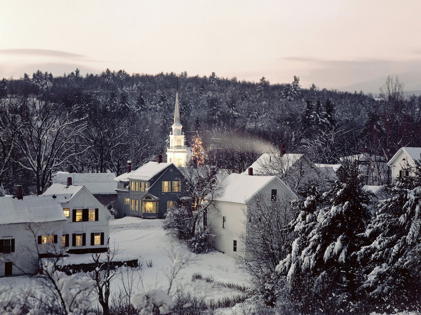 Snowy village at dusk