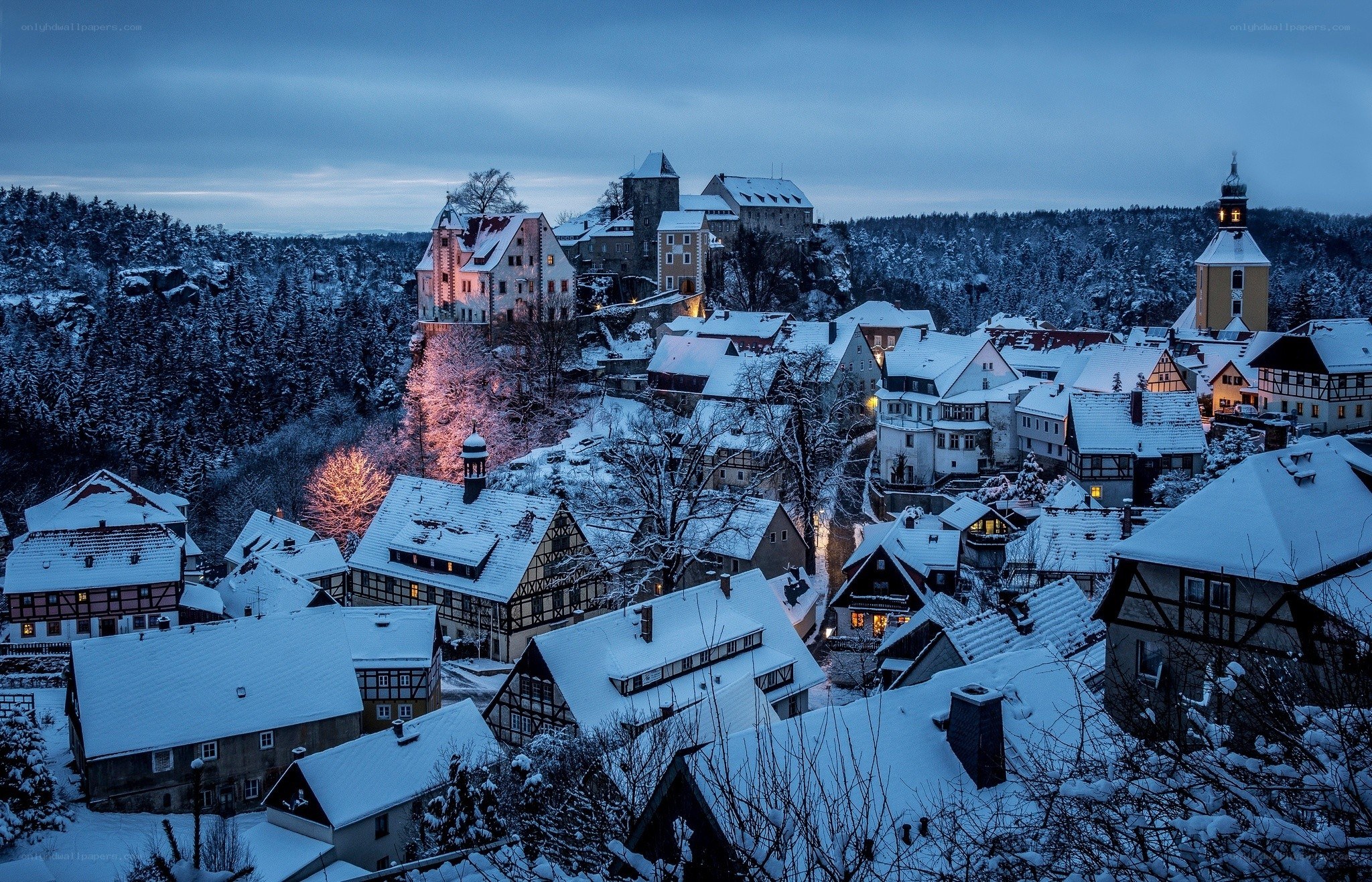 Snowy village at dusk