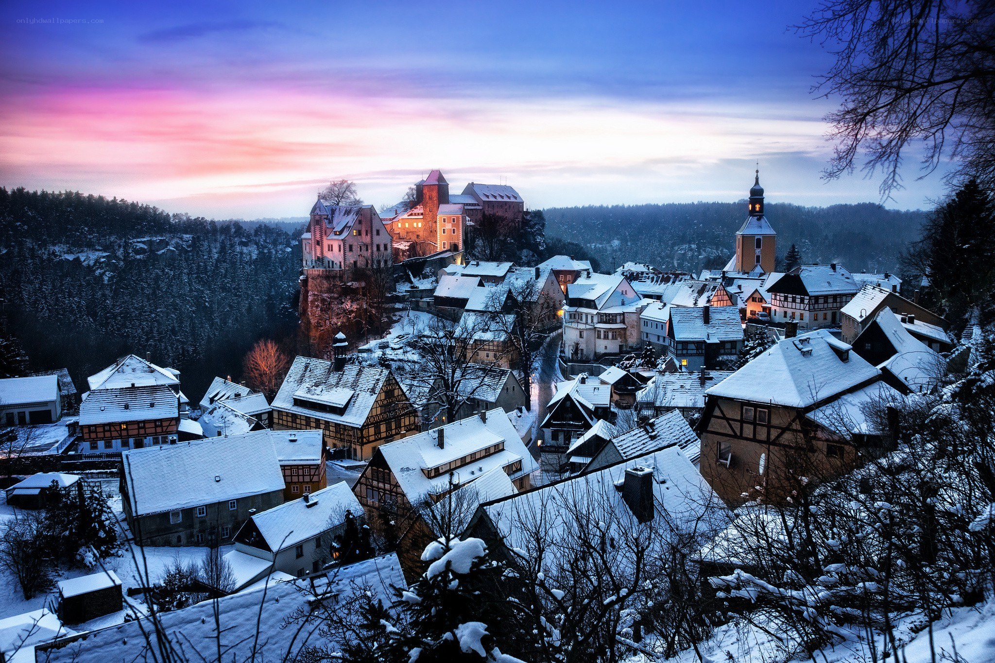 Snowy village at dusk