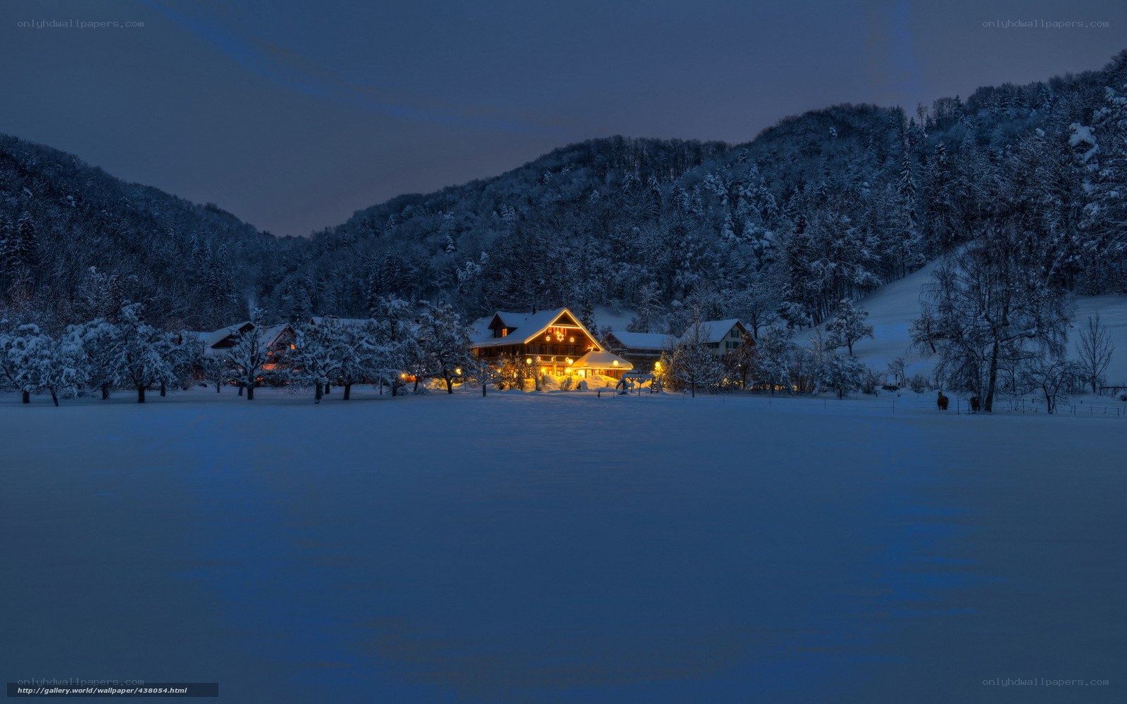 Snowy village at dusk
