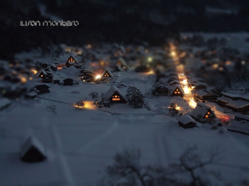 Snowy village at night