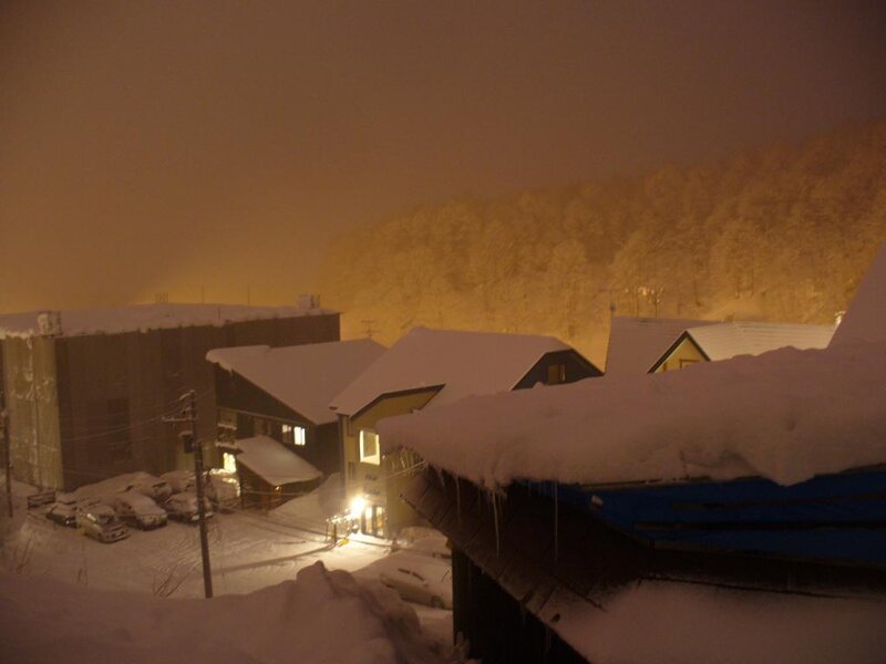 Snowy village at night