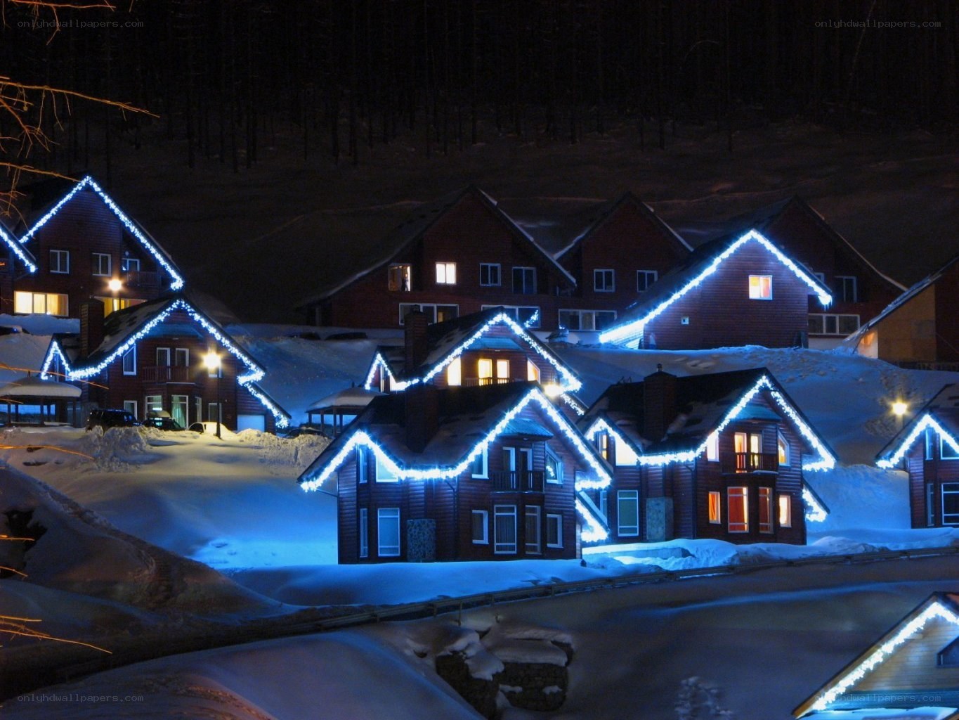 Snowy village at night