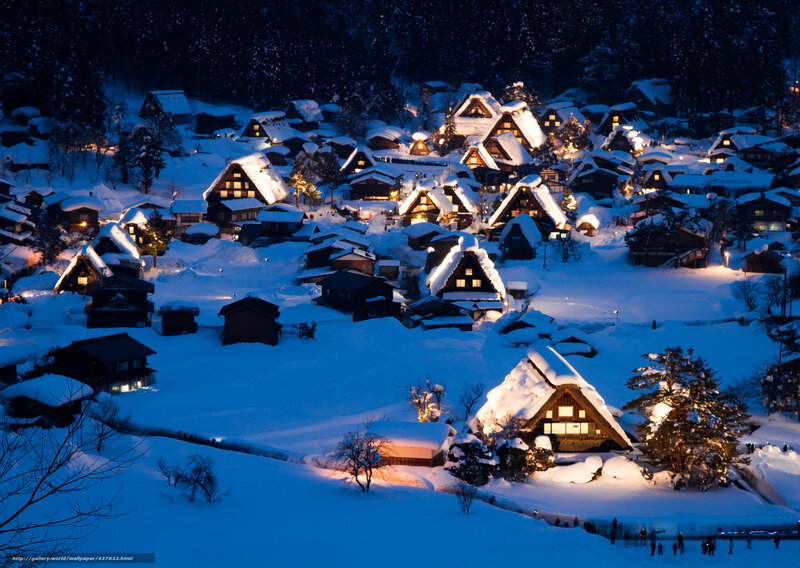 Snowy village at night