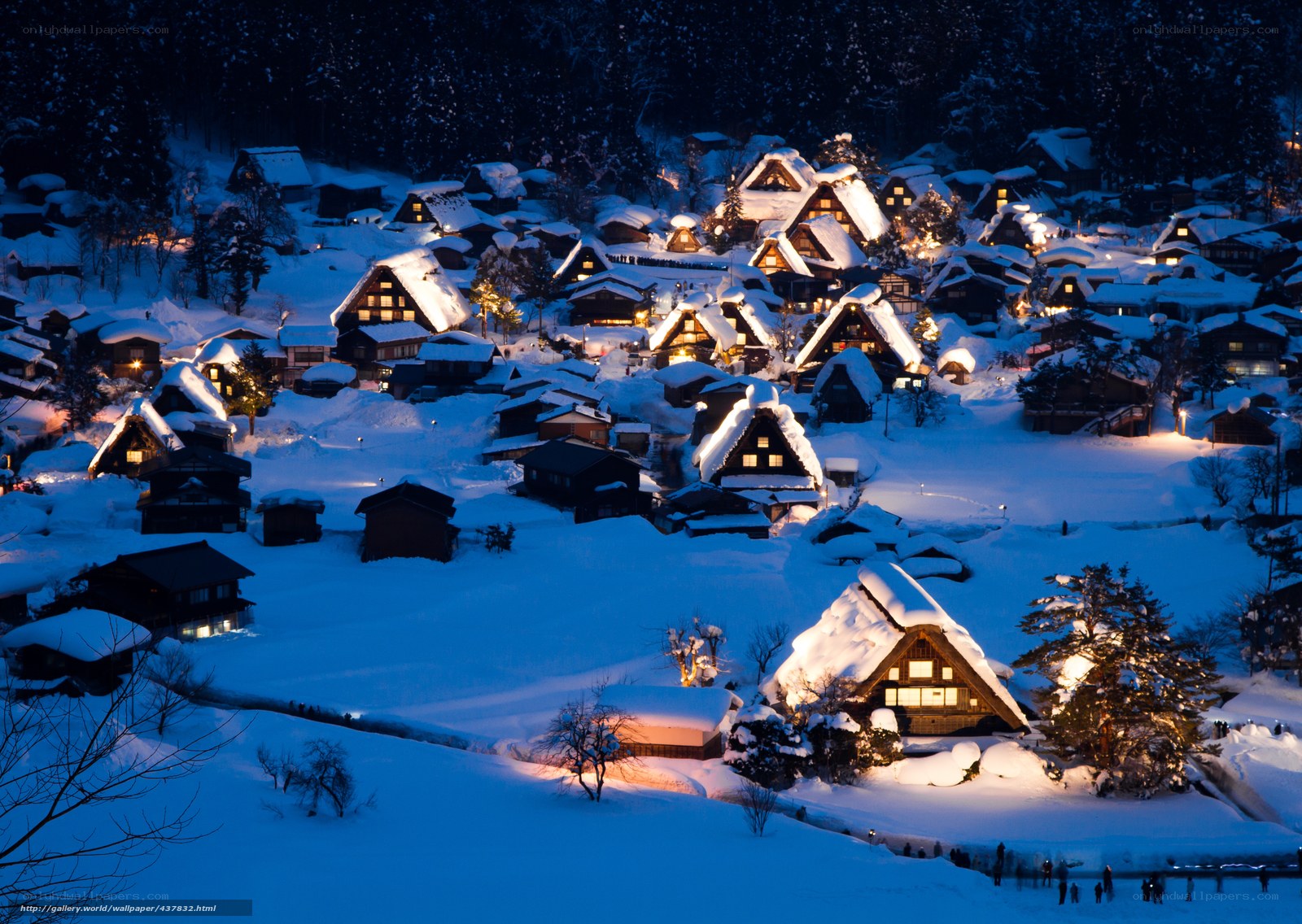 Snowy village at night