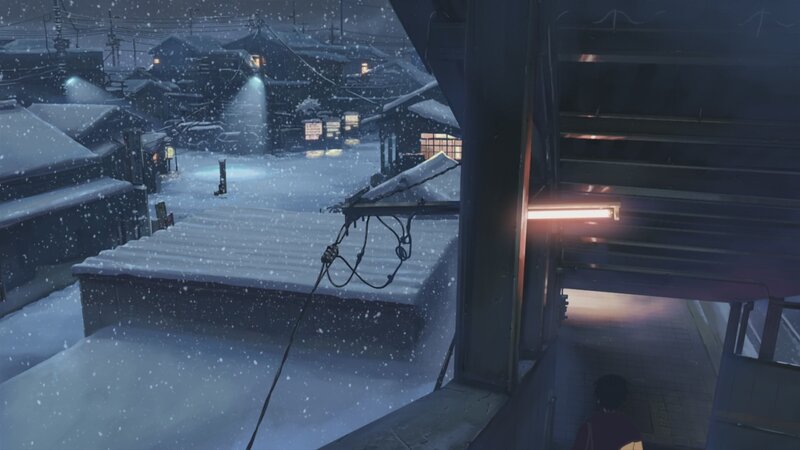 Snowy village at night