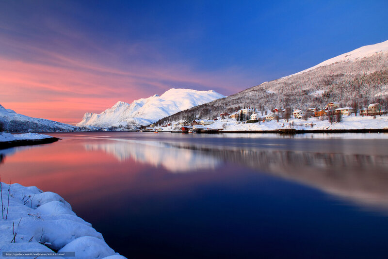 Snowy village at sunset