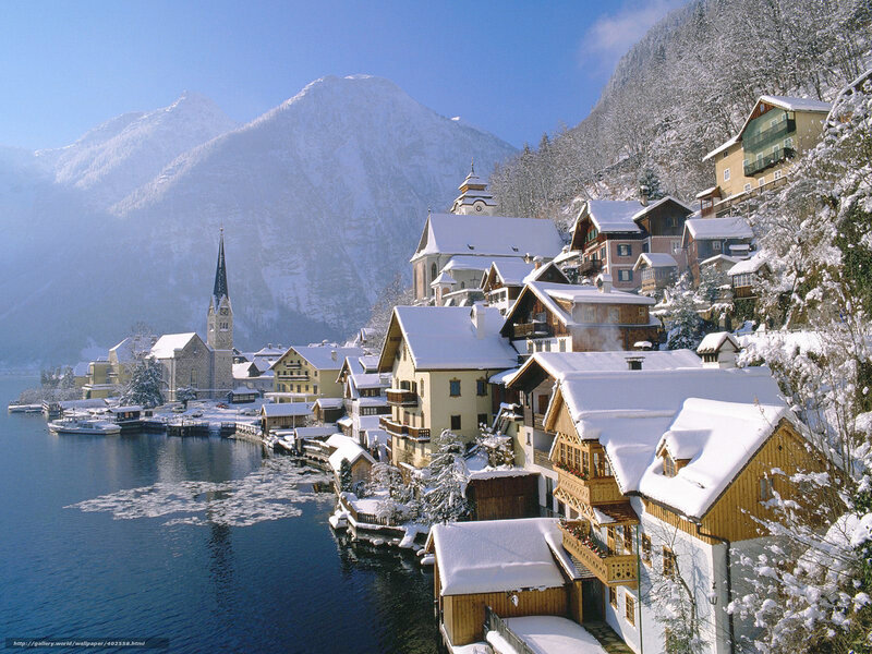 Snowy village by a lake