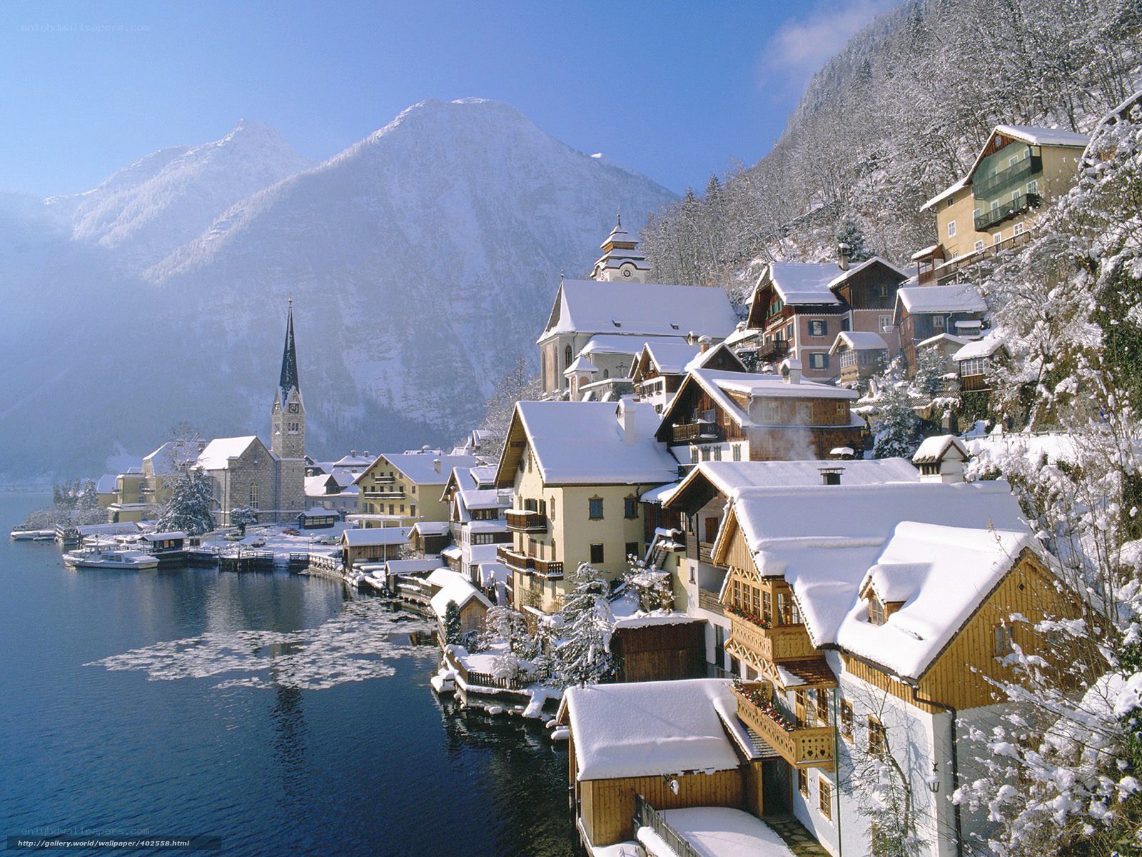 Snowy village by a lake