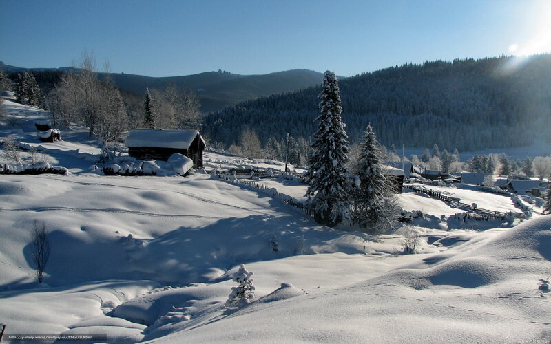 Snowy village in mountain valley