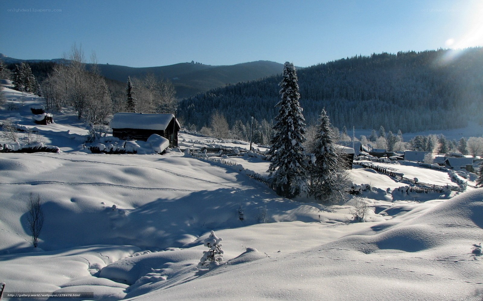 Snowy village in mountain valley