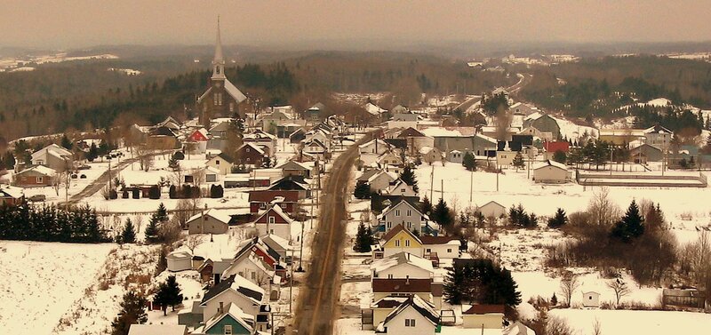 Snowy village with church steeple