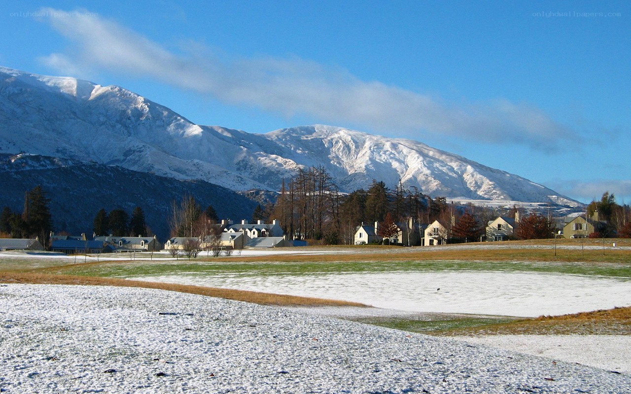 Snowy village with mountains