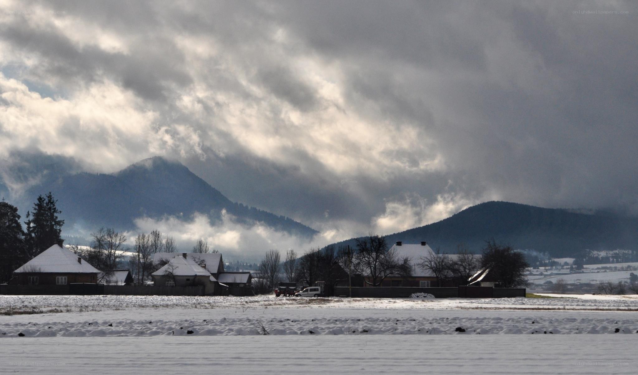 Snowy village with mountains